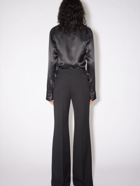 Черные брюки клеш Acne Studios: фото 2 - Invogue
