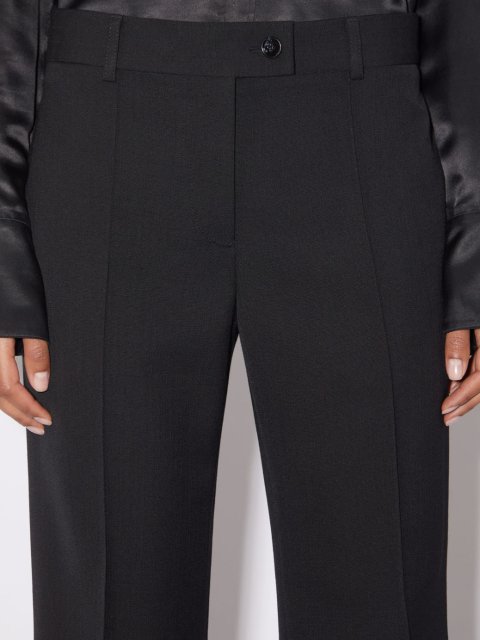 Черные брюки клеш Acne Studios: фото 4 - Invogue