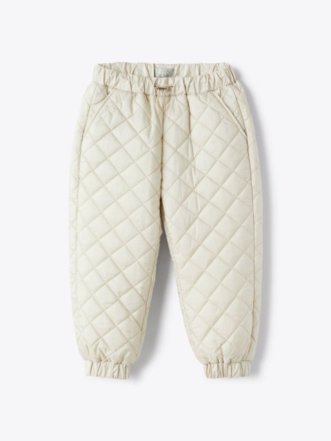 Бежевые брюки IL GUFO стеганые: фото - Invogue