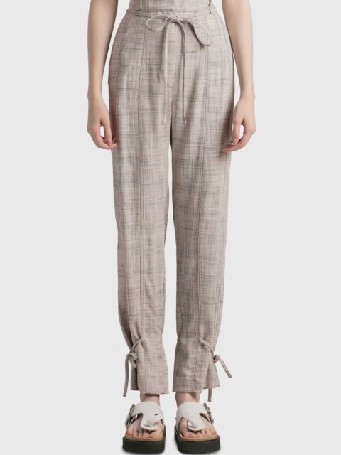 Бежевые брюки Acne Studios с завязками: фото 1 - Invogue