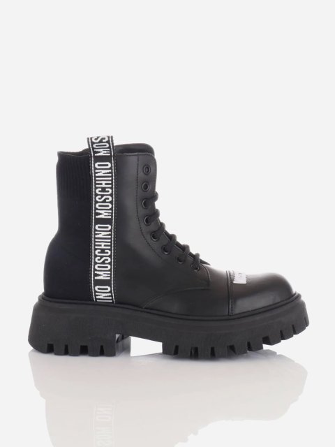 Чорні чоботи MOSCHINO на шнурівці: фото - Invogue