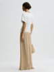 Темно-бежевые брюки By Malene Birger свободного кроя: фото 3 - Invogue