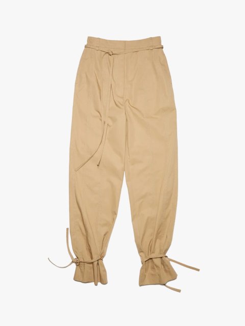 Бежевые брюки ACNE STUDIOS: фото - Invogue