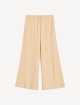 Темно-бежевые брюки By Malene Birger свободного кроя: фото - Invogue